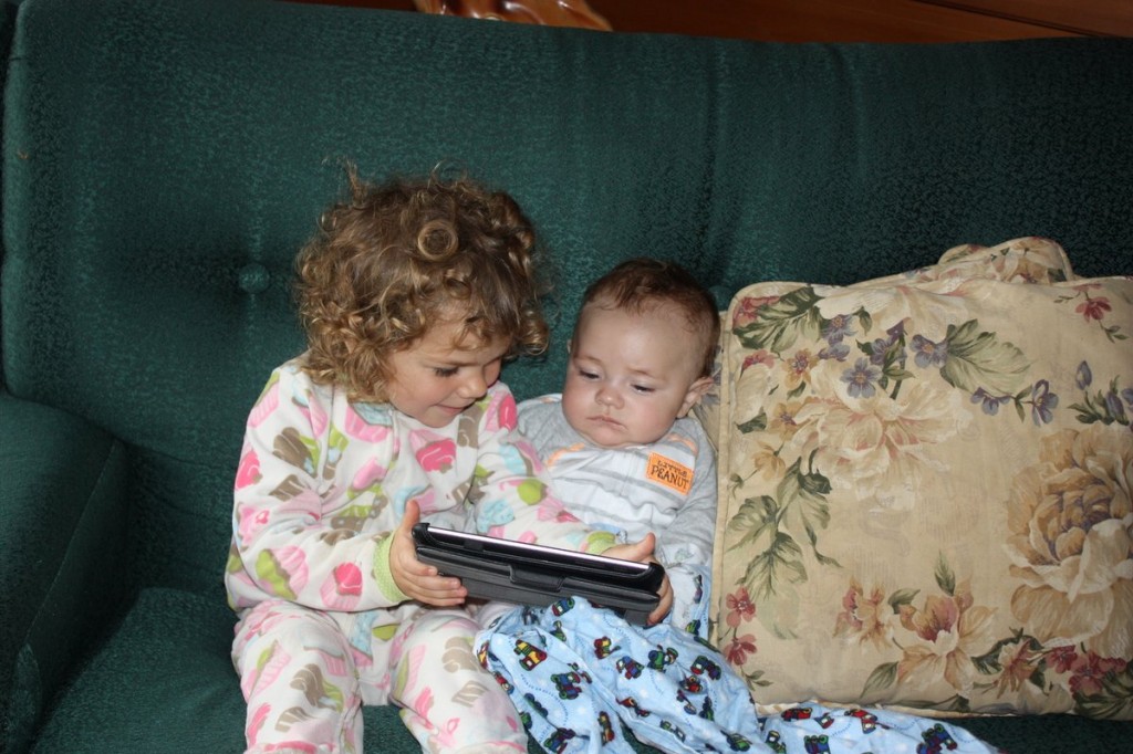 Mikayla Teaching Timothy to Use the Tablet