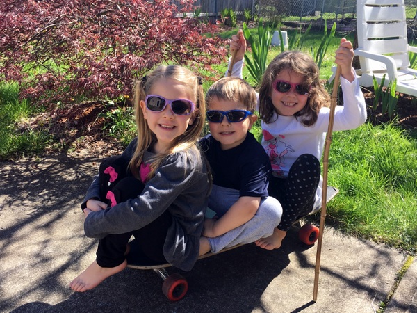 Mikayla, Laurel, and Timothy on their skateboard boat
