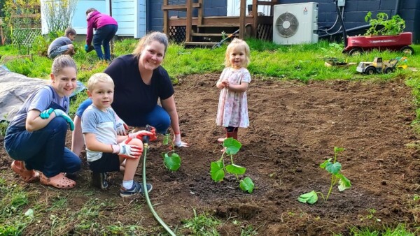Christina planting with Laurel, Nathaniel, and Adalynn Christina planting with Laurel, Nathaniel, and Adalynn